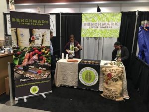 Two women standing at their custom designs Tradeshow Display